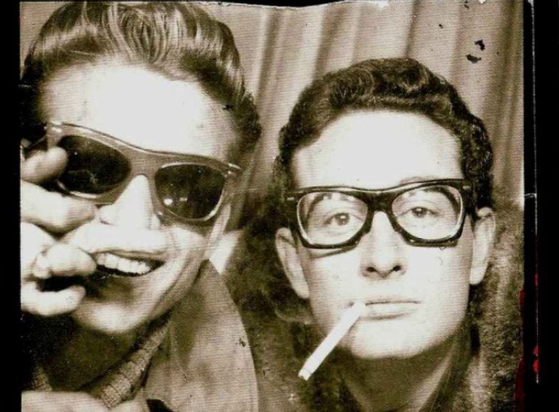 Buddy Holly and Waylon Jennings in a photobooth, 1959