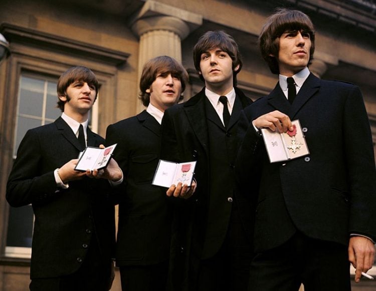 The Beatles showing their MBE Insignias