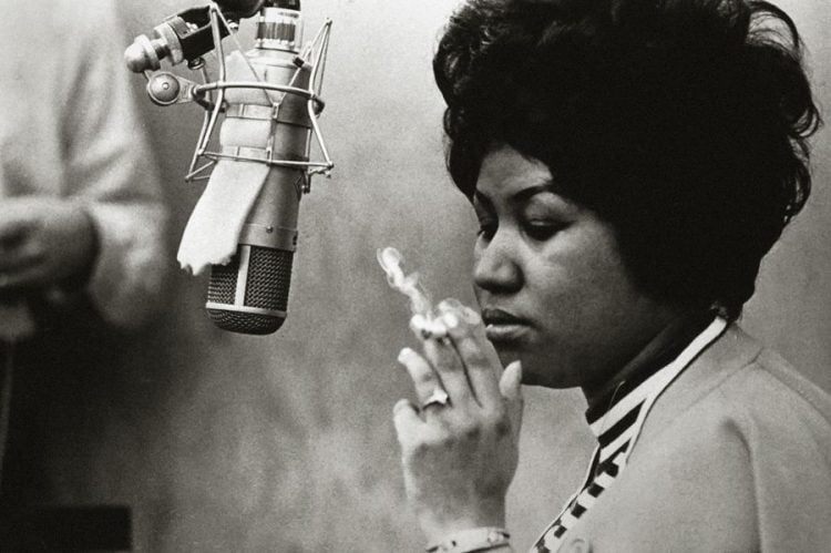 Aretha Franklin in front of a microphone