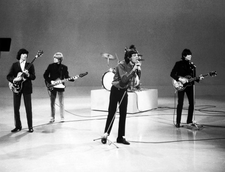 Mick Jagger and the musicians of the Rolling Stones perform on the "Ed Sullivan Show."
