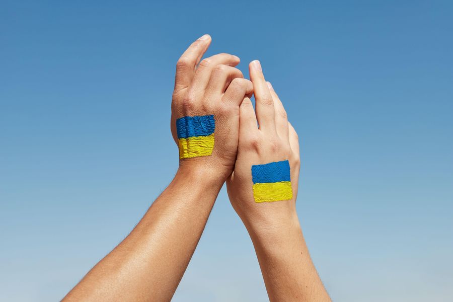 Ukraine flag colors holding. Stop the war