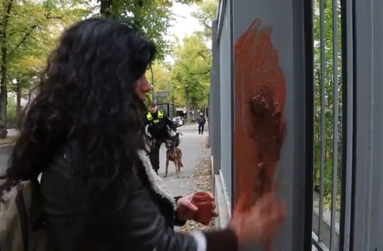 Artist Zehra Doğan smears blood on the Iranian embassy in protest