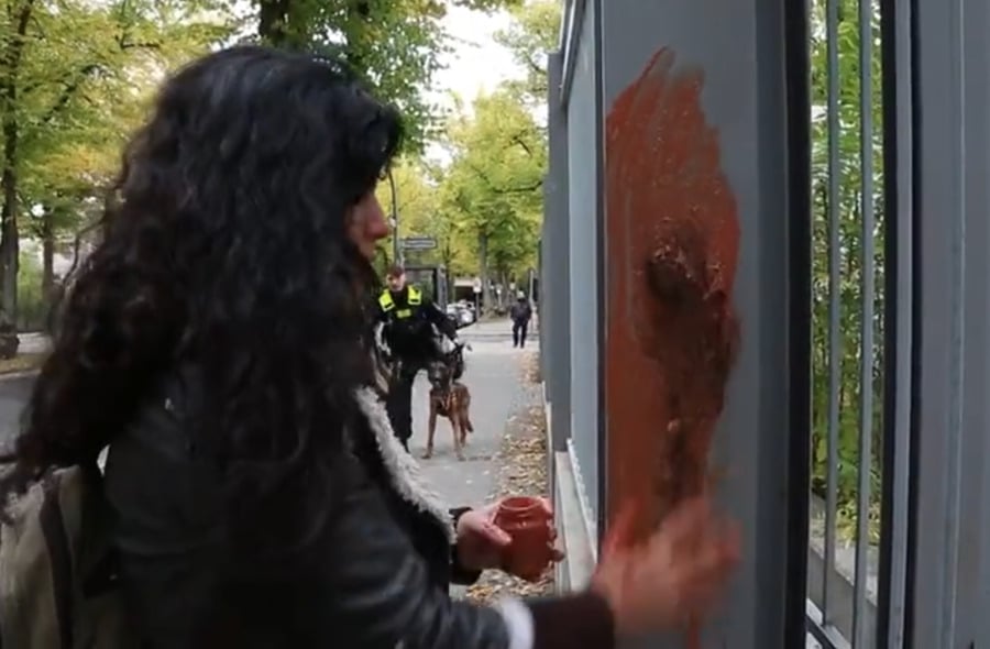 Artist Zehra Doğan smears blood on the Iranian embassy in protest