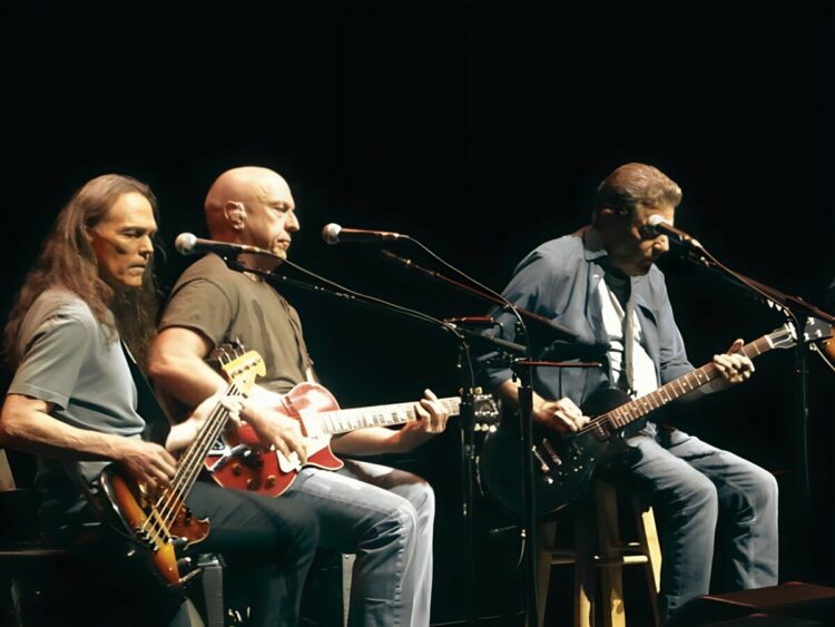 The Eagles in concert, "History of the Eagles" tour, Grand Rapids, September 2014. Doolin-Dalton. Left to right - Timothy B. Schmit, Bernie Leadon,...