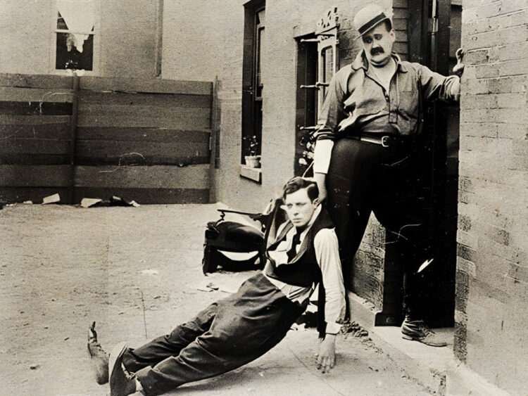 Buster Keaton (left) and Joe Roberts in the movie Neighbors (1920)
