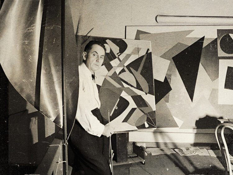 Man Ray in his Paris workshop