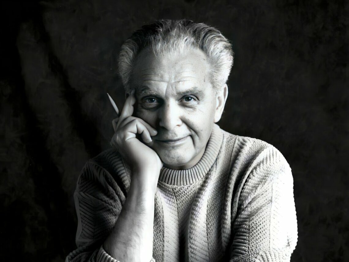Photo of Jack Kirby taken by Susan Skaar during a session in the studio at Jack's home in Thousand Oaks, CA. The photos were later published in The...