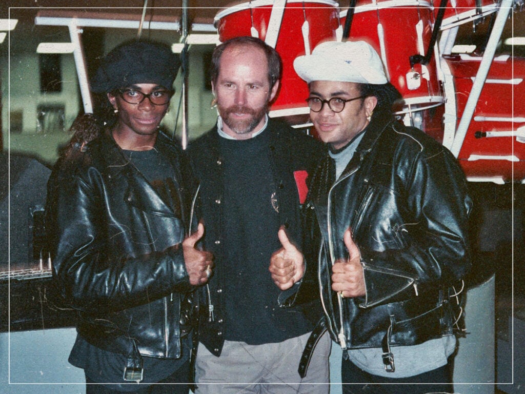 Milli Vanilli pose with Grammy President C. Michael Greene during rehearsal - 1990