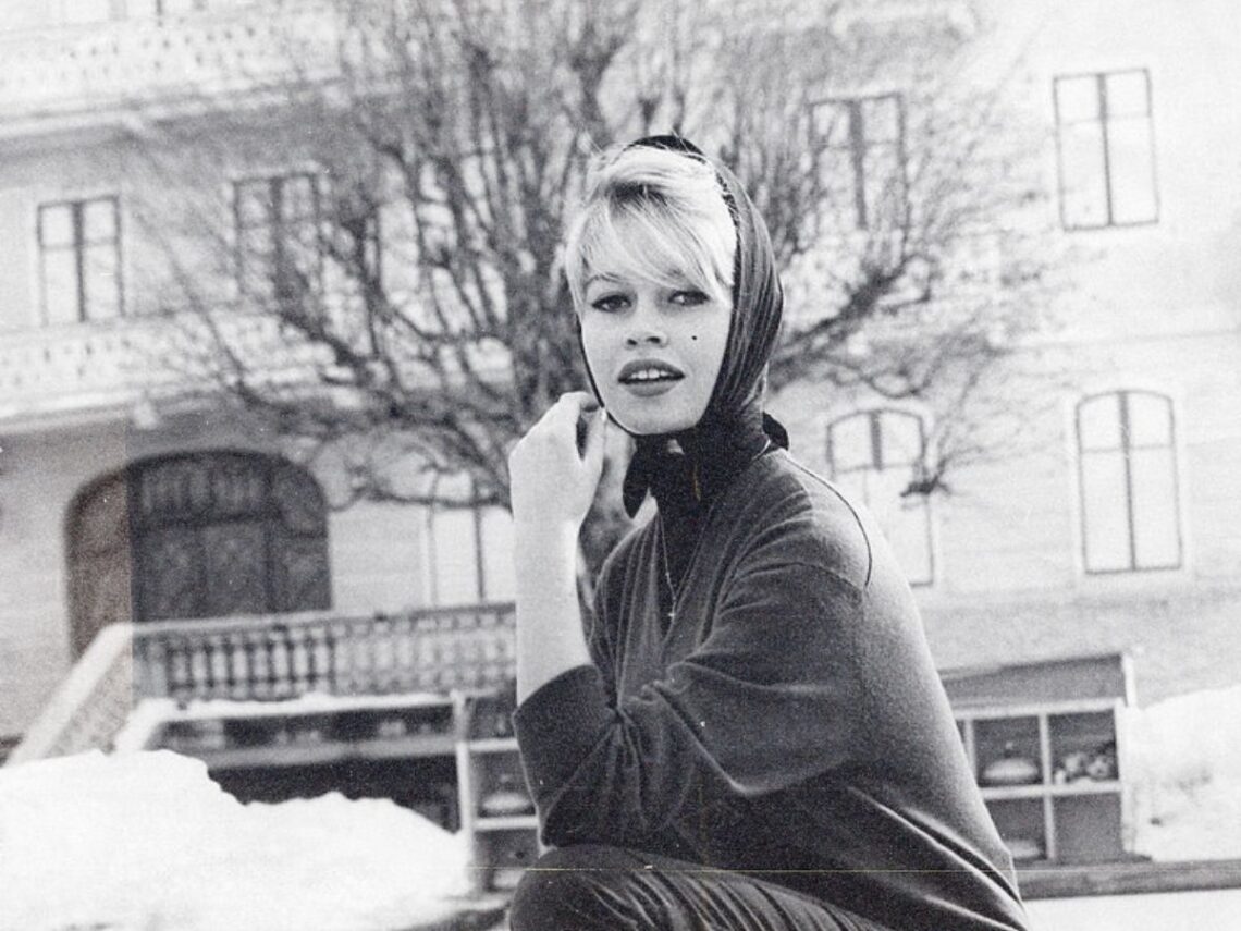 The French actress and model Brigitte Bardot posing on a curling field