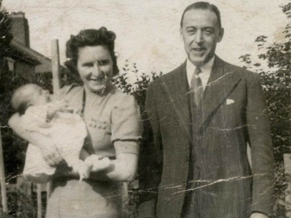Paul McCartney as a baby with his parents Mary and James.