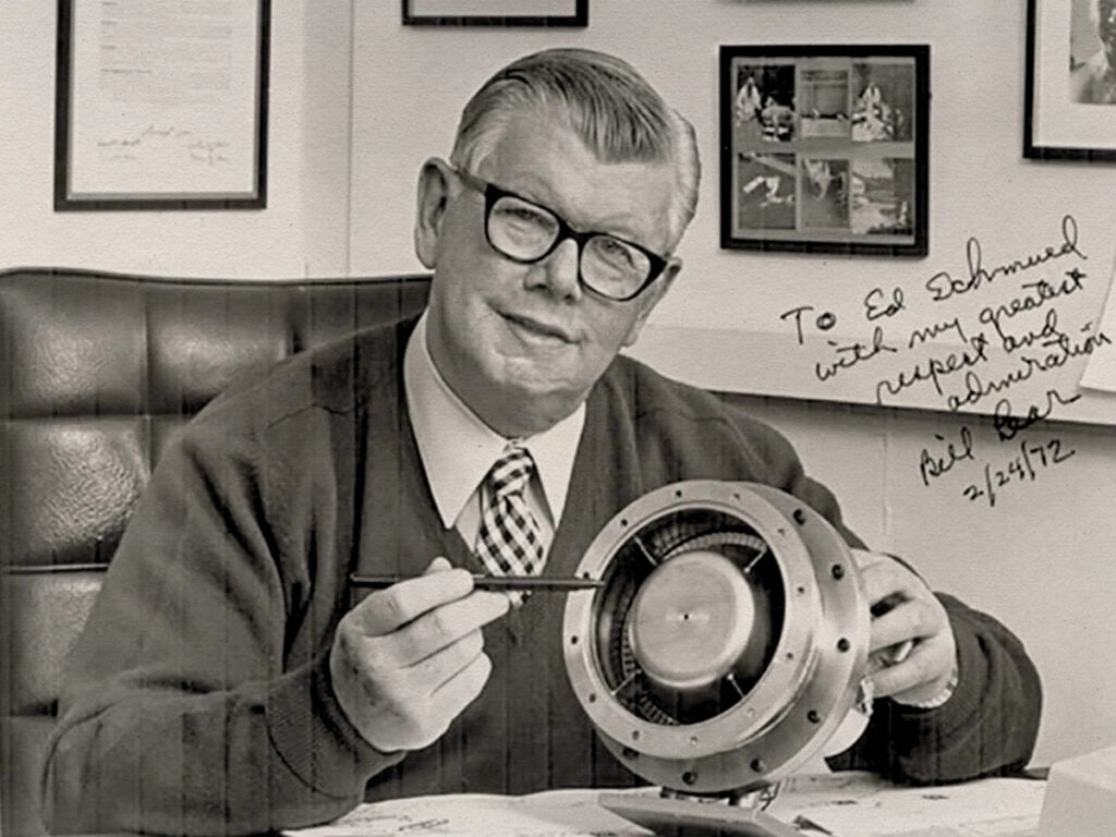 Bill Lear with a model of his turbine engine.