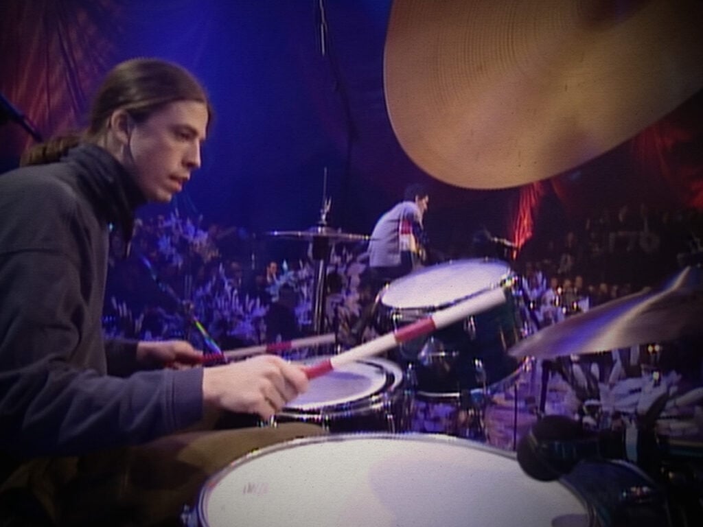 Dave Grohl performs with Nirvana at MTV Unplugged - 1994.