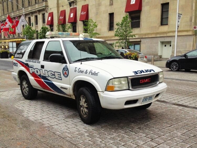 Toronto Police Services GMC Jimmy, PD03, Ontario license plate ATHD 885, on Front Street, Toronto, Ontario. Vehicle is for the Police Dog Services.